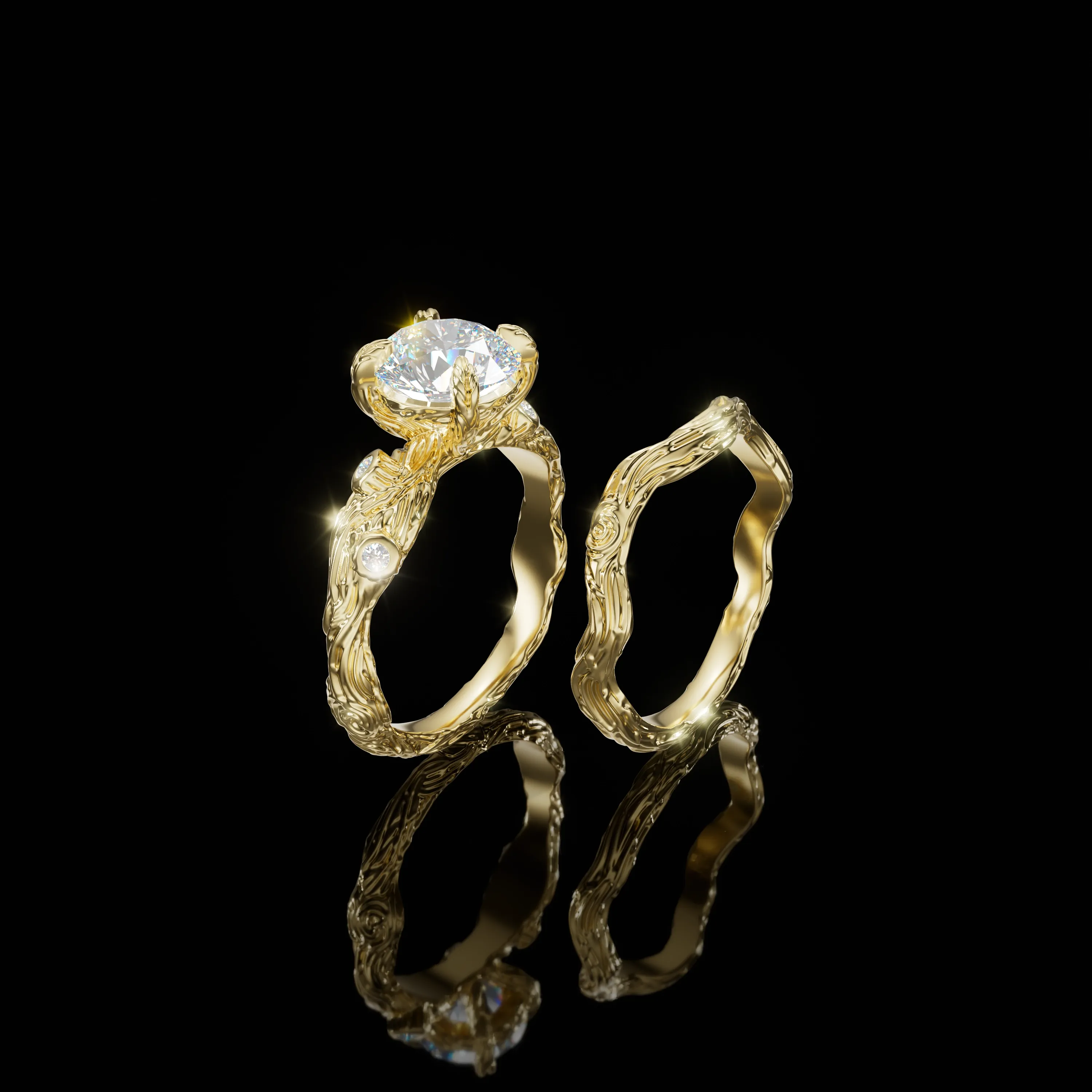 Two sculptural gold bridal rings with diamond details and tree-like textures on a black background